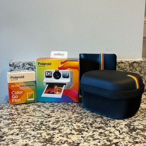 Polaroid Go instant print camera with film, case, and photo album. Unopened!